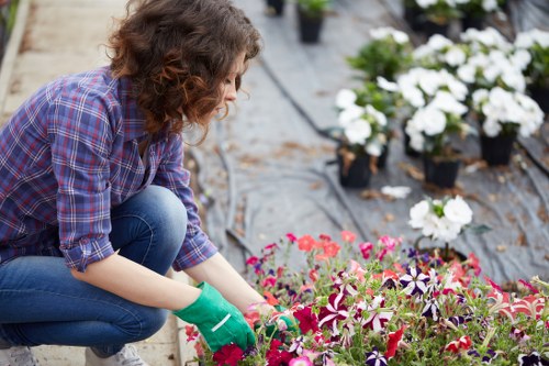 Landscaping team sorting green waste for eco-friendly disposal in Charlton